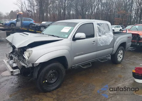 2014 Toyota Tacoma Base V6 z USA, uszkodzony, nr VIN 3TMLU4EN7EM136997